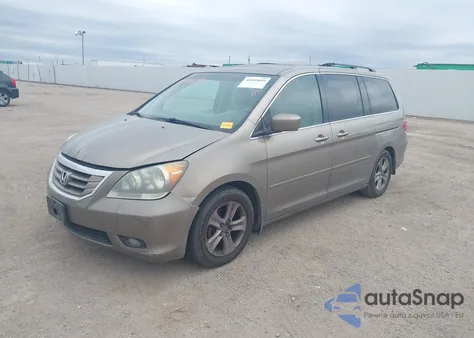 2010 Honda Odyssey Touring z USA, uszkodzony, nr VIN 5FNRL3H90AB047535